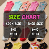 Colorful socks with a size chart on a wooden surface