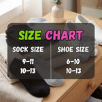Stack of socks with size chart overlay on a wooden table.