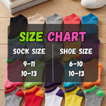 Colorful socks displayed with a size chart on a wooden surface