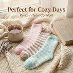 Pair of striped socks on a soft blanket with a cup of tea, book, and lavender flowers.