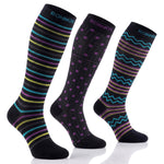 Three knee-high socks by Ronnox on a white background, each with a different colorful stripe and pattern design on a black base.