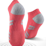 Red socks with gray cushioned sole on a white background