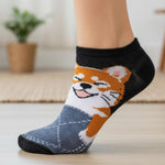 Sock with a dog design worn by a person indoors