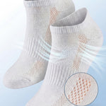 Gray socks with breathable mesh design on a light blue background