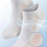 Gray socks with breathable mesh design on a light blue background