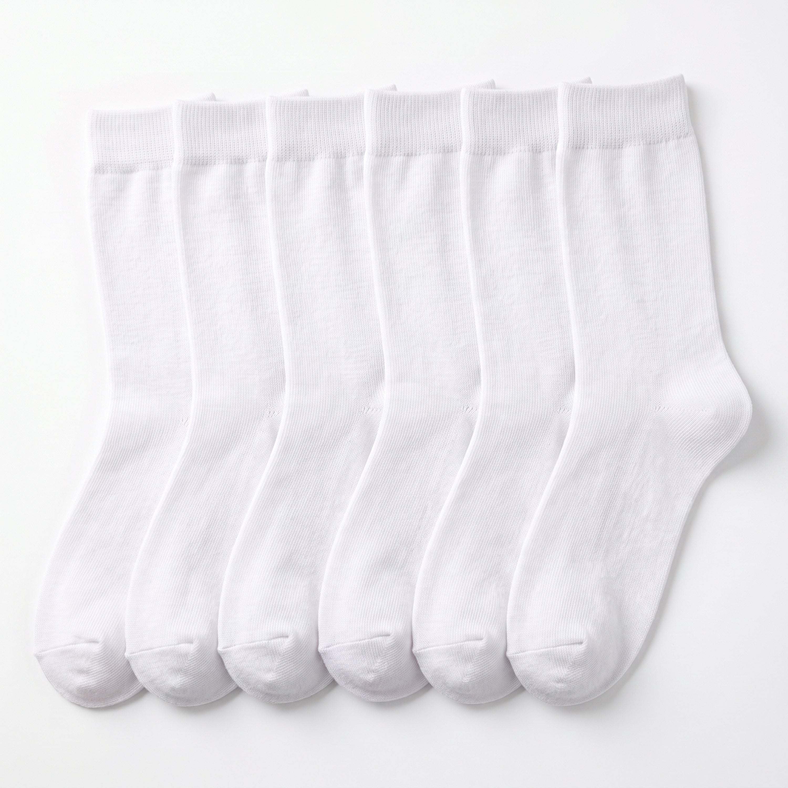 Six pairs of plain white crew socks arranged side by side on a clean white background.