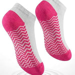 Two pink and gray socks with zigzag pattern on a white background, emphasizing cushioned sole comfort.