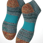 Pair of striped socks with cushioned sole on a white background