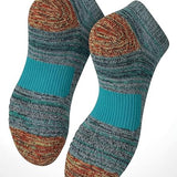 Pair of striped socks with cushioned sole on a white background