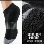 Black ankle sock with gray sole on a white background, showing ultra-soft padding and advanced fiber technology.