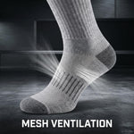 A gray knit sock shown on a foot against a dark studio background, with bright light rays and small particles emphasizing mesh ventilation. Large white text at the bottom reads “MESH VENTILATION.