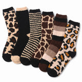 Set of patterned socks including leopard print, striped, and checkered designs on a white background.