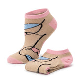 A pair of low-cut ankle socks in beige with pink cuffs, heels, and toes, featuring a black and blue line-art graphic of a stylized face.