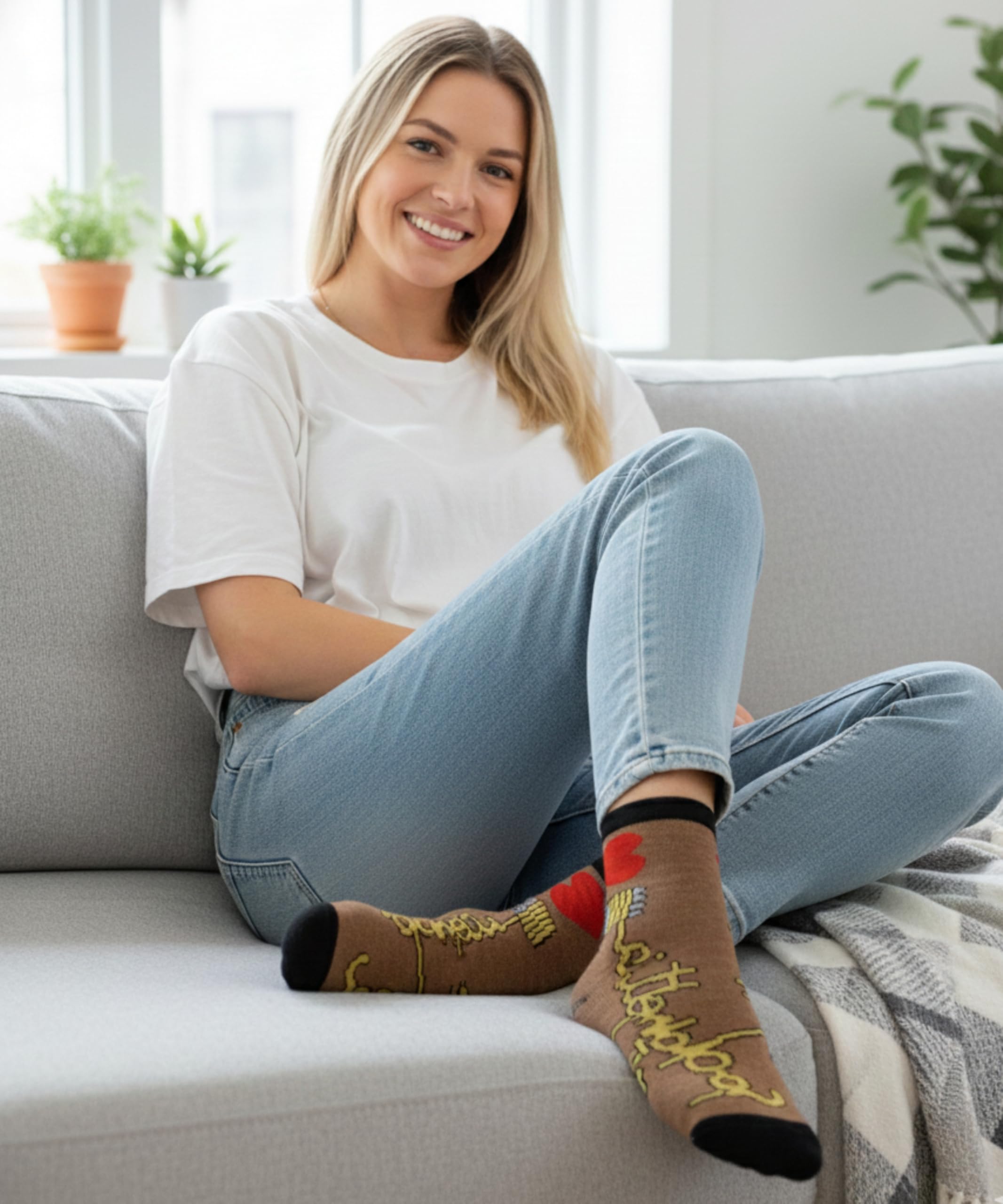 Woman sitting on a couch wearing colorful socks with text