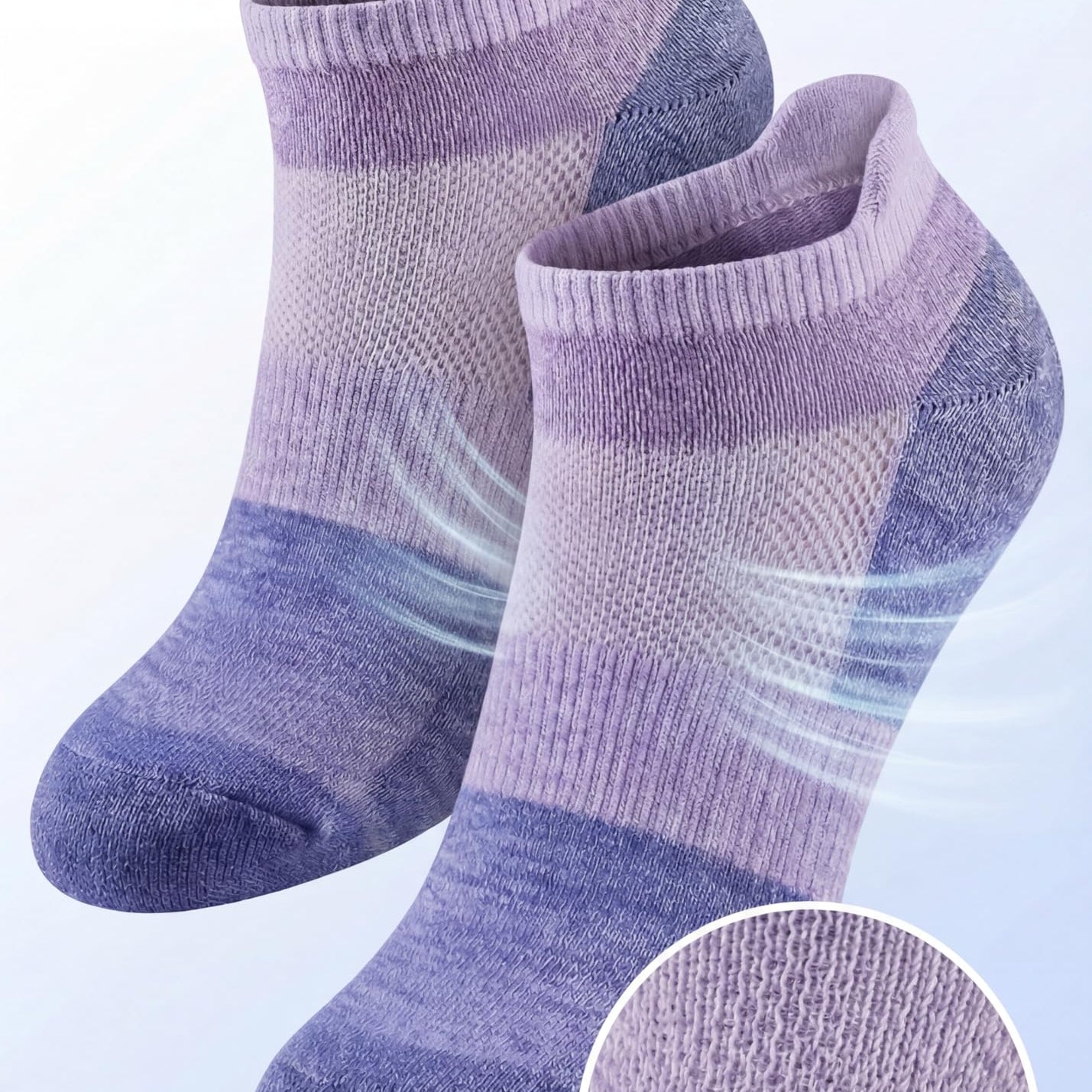 Pair of purple and gray socks with breathable mesh ventilation on a light blue background.