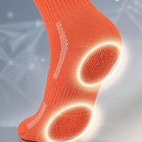 Orange sock with cushioned sole technology on a gray background
