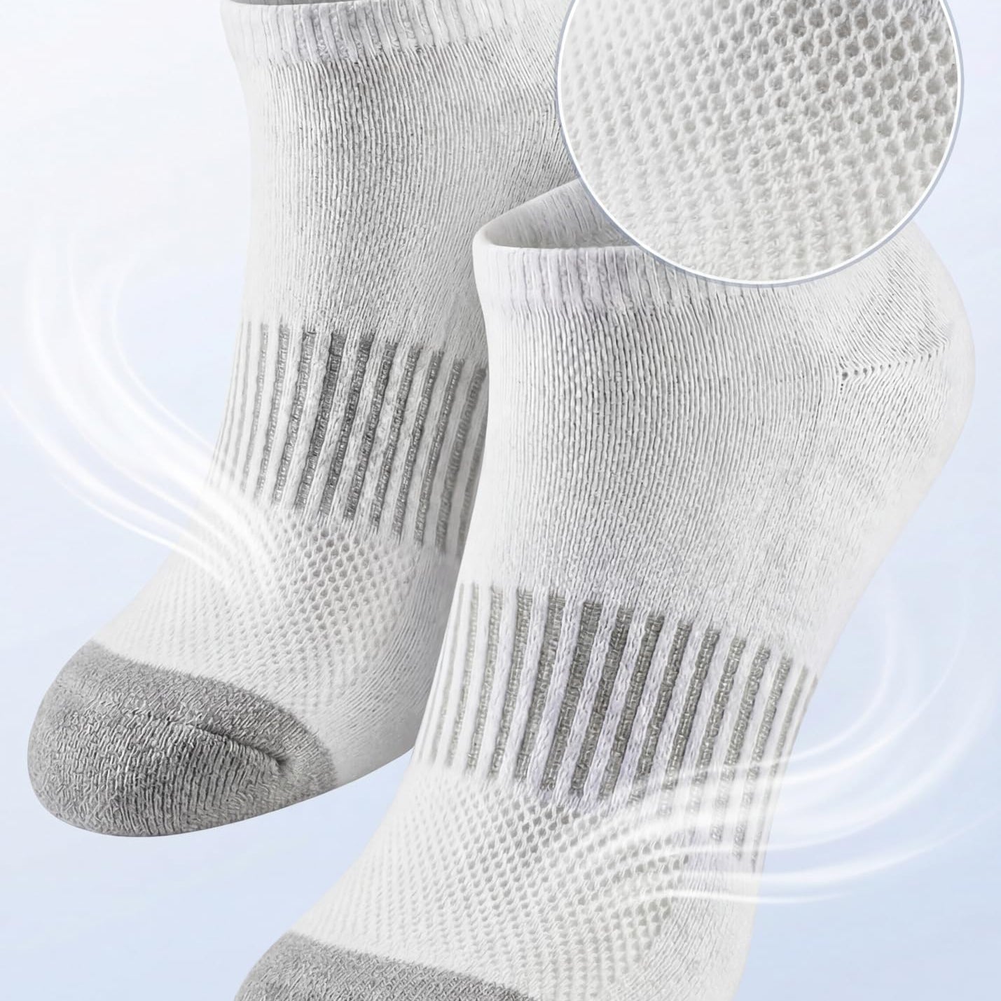 White socks with gray toes and heels on a light blue background, highlighting breathable mesh ventilation.