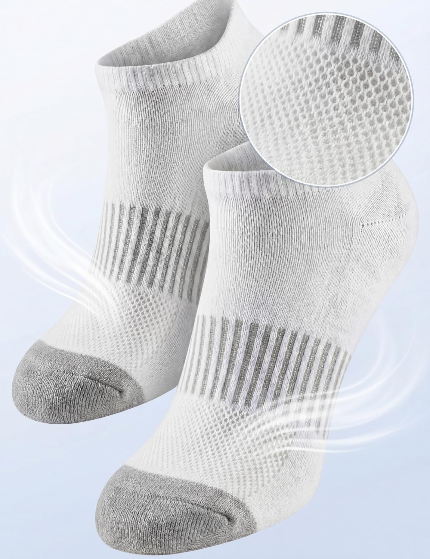 White socks with gray toes and heels on a light blue background, highlighting breathable mesh ventilation.