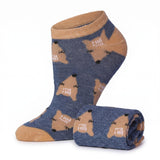 A pair of low-cut ankle socks in heathered navy blue with tan accents and a repeating cartoon dog pattern, shown with one sock upright and the other rolled on a white background.