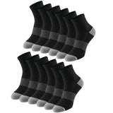 Multiple pairs of black socks with gray accents on a white background