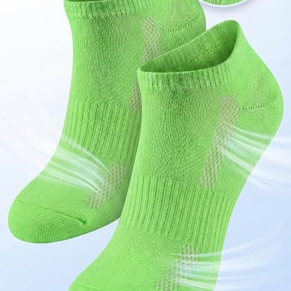 Green socks with breathable mesh design on a light gray background