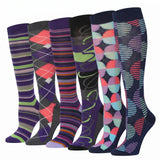 Six pairs of knee-high socks in different colorful patterns, arranged side by side on a plain white background.