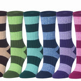 Six pairs of striped crew socks in different colorways, arranged side by side against a plain white background. The colors include dark brown and beige, green and lime green, teal and aqua, navy and blue, lavender and purple, and pink and magenta.