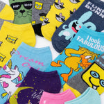 Collection of colorful socks with various designs on a white background