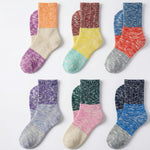 Six pairs of marled colorblock ankle socks arranged in a 2x3 grid on a white background. The socks feature distinct color blocks including orange, purple, yellow, red, blue, pink, green, and navy, with heathered knit textures.