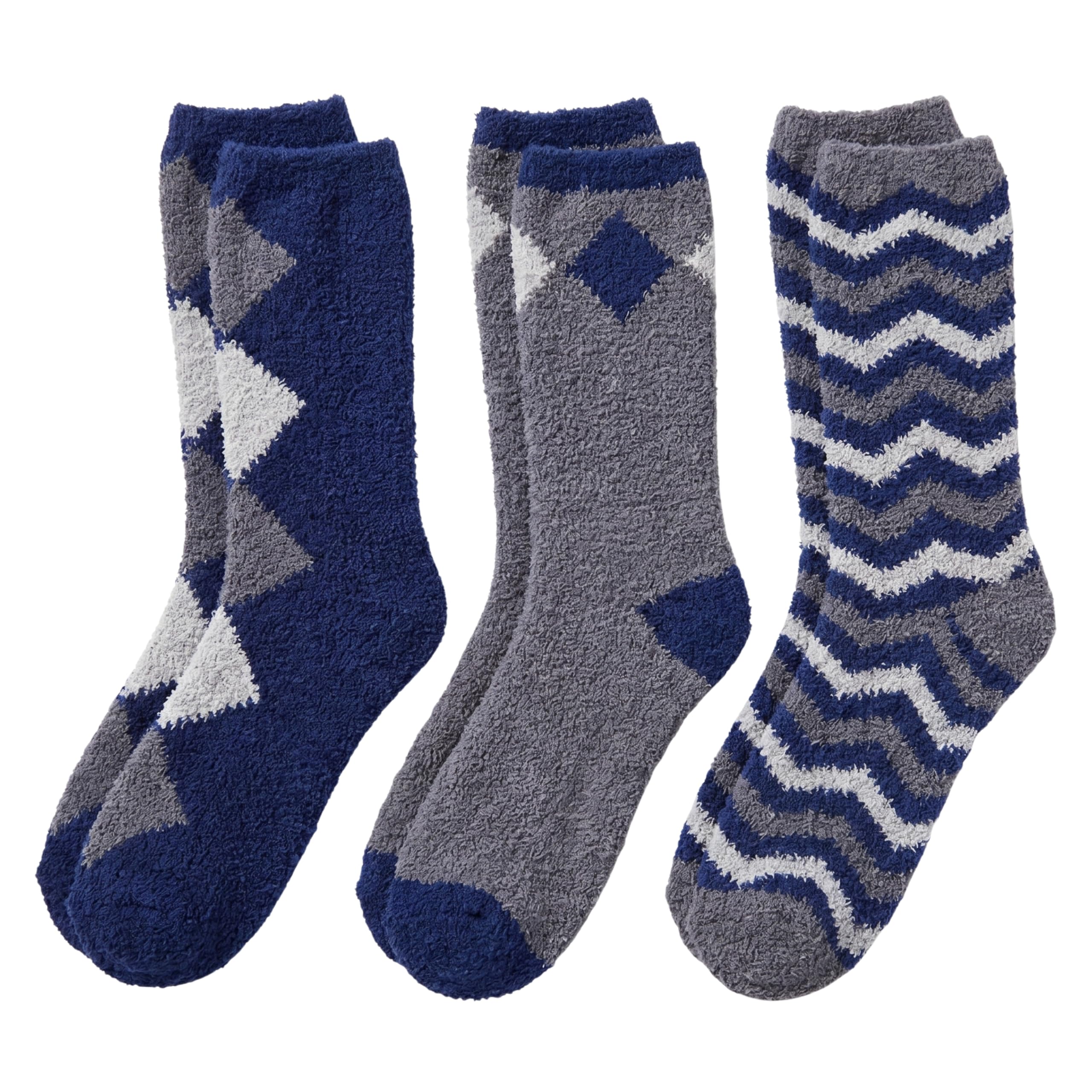Three pairs of fuzzy crew socks shown on a white background: navy and gray with geometric patterns, gray with a blue diamond accent, and gray and navy with a chevron pattern.