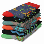 A stack of eight folded patterned socks on a plain white background, showing various colorful designs including cacti, stripes, and geometric patterns.