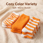 Three pairs of cozy striped socks in orange and white are displayed on a textured cream knit blanket, with the text 'Cozy Color Variety Soft • Warm • Stylish' at the top.