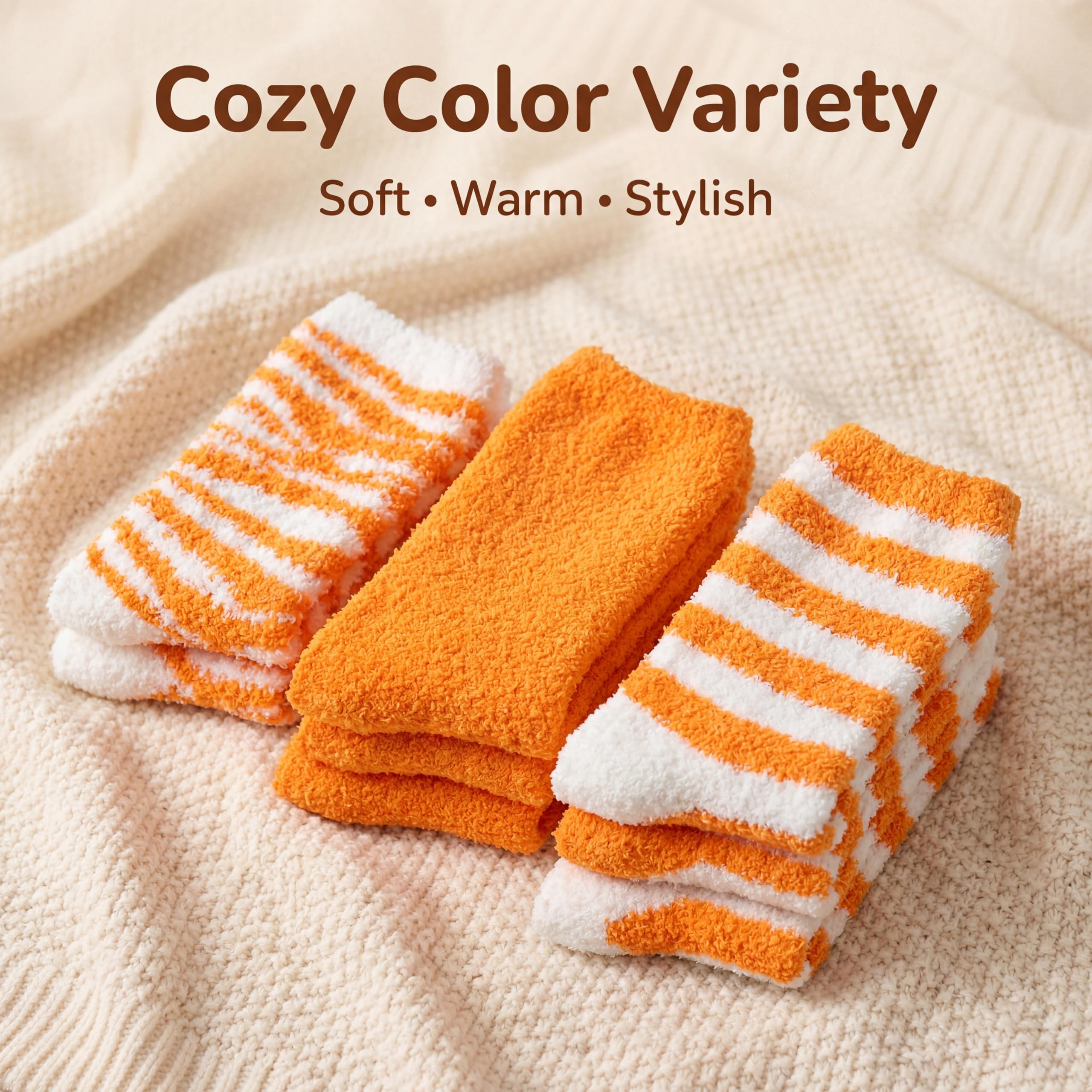 Three pairs of cozy striped socks in orange and white are displayed on a textured cream knit blanket, with the text 'Cozy Color Variety Soft • Warm • Stylish' at the top.