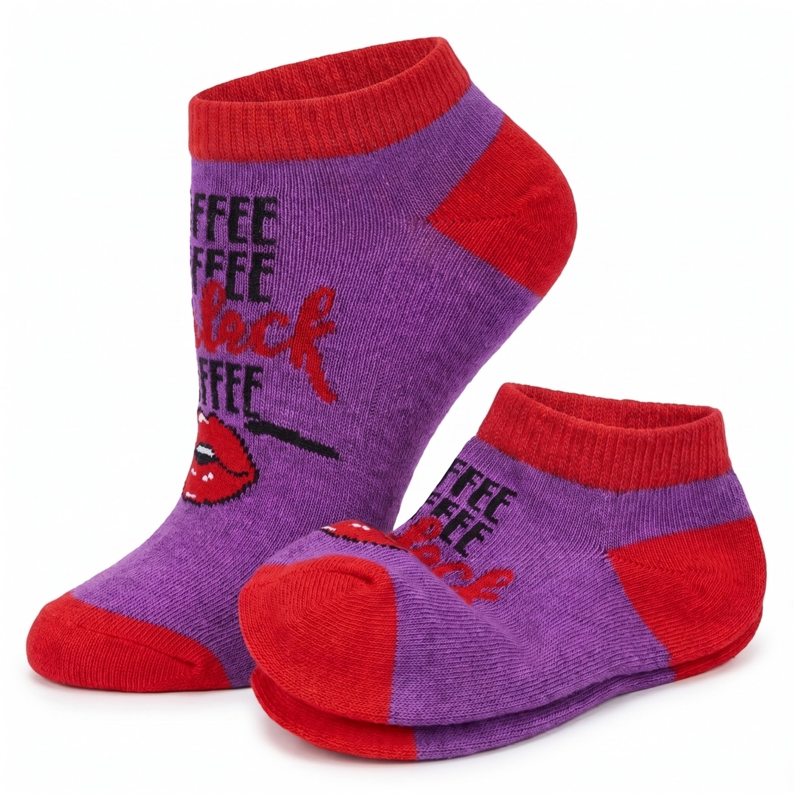 A pair of low-cut ankle socks in purple and red with a graphic design. The design features the word 'COFFEE' repeated in black, stylized red script reading 'black coffee', and a graphic of red lips with a black line drawing.