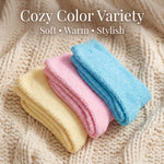 Three folded towels in yellow, pink, and blue on a textured beige surface with text 'Cozy Color Variety' and 'Soft • Warm • Stylish'.