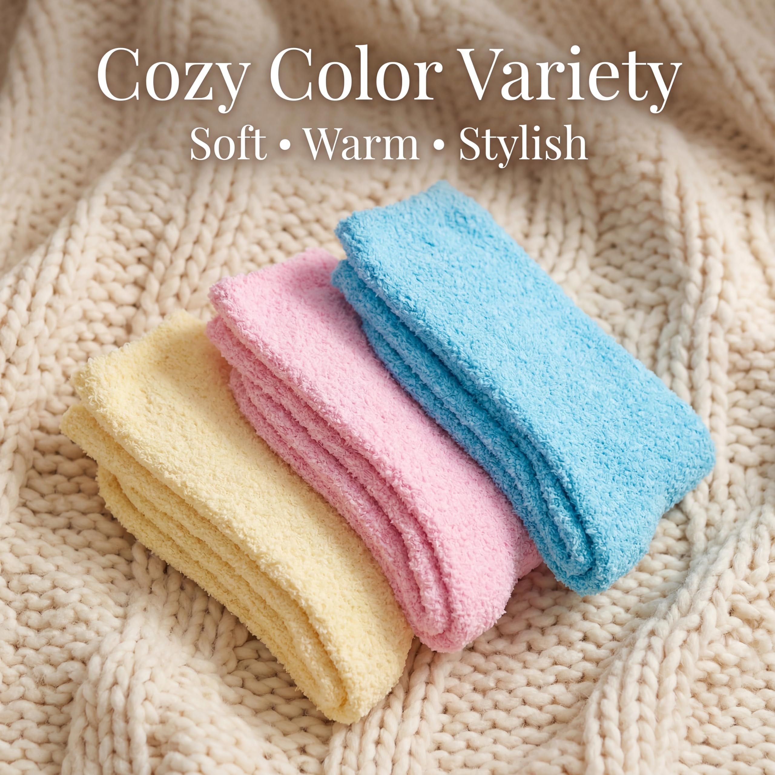 Three folded towels in yellow, pink, and blue on a textured beige surface with text 'Cozy Color Variety' and 'Soft • Warm • Stylish'.