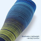 A close-up of a blue and navy compression sleeve with yellow-green striped knit detailing near the lower section, shown on a light gray background with text reading 'Breathable • Lightweight • All-Day Comfort'.