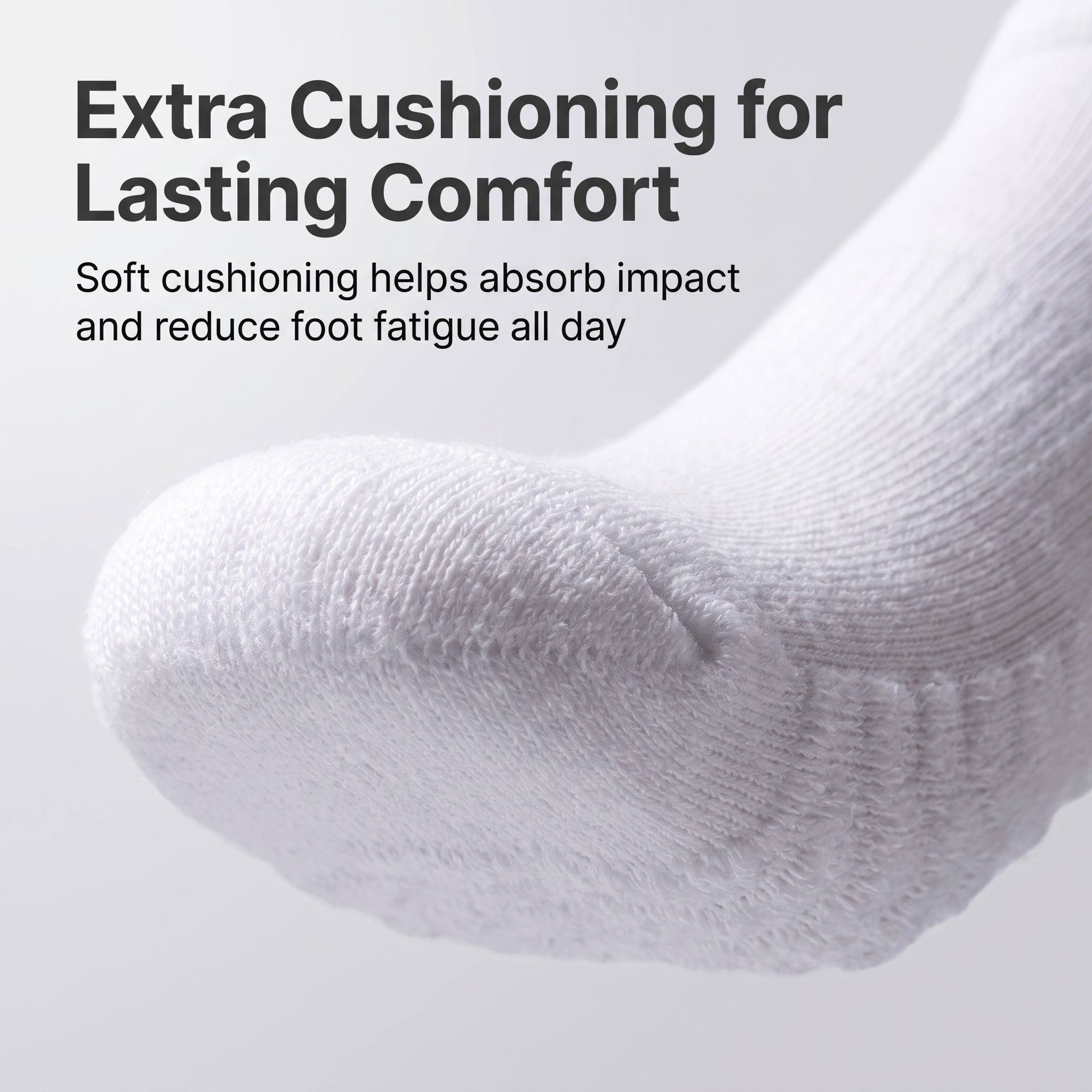 A close-up of a white knit sock on a light gray background with promotional text reading 'Extra Cushioning for Lasting Comfort' and 'Soft cushioning helps absorb impact and reduce foot fatigue all day.'.