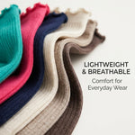 A close-up of several ribbed knit socks or hosiery pieces fanned out in different colors, including teal, pink, navy, cream, taupe, and brown, with text reading 'LIGHTWEIGHT & BREATHABLE Comfort for Everyday Wear' on a light background.