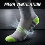 A gray athletic sock with bright green toe and heel accents, shown on a foot against a dark textured background with white text reading 'MESH VENTILATION' and airflow graphics.