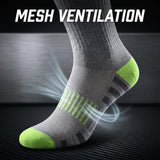A gray athletic sock with bright green toe and heel accents, shown on a foot against a dark textured background with white text reading 'MESH VENTILATION' and airflow graphics.