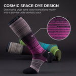 A pair of athletic compression socks with a cosmic space-dye design, featuring a prominent purple and black striped sock in the foreground, with other multicolor socks (green, blue, gray) blurred in the background. A circular inset highlights the knit texture of the purple pattern.