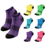 A set of low-cut athletic socks shown in multiple colorways on a plain white background. The main pair in the foreground is purple with black toe, heel, and striped mid-calf detailing, while smaller pairs around it appear in yellow, green, aqua, blue, purple, and pink.