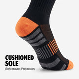 A single athletic sock shown on a foot against a light gray background, with text reading 'CUSHIONED SOLE Soft Impact Protection.' The sock is predominantly black with bright orange heel and toe sections and gray striped compression zones.