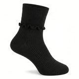 A single black ankle sock with a ruffled trim at the ribbed cuff, shown on a white background.