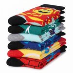 A stack of eight folded novelty socks with colorful cartoon and graphic patterns, including Spider-Man and other characters, on a white background.