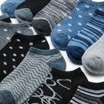 Assorted patterned socks including blue, gray, and black on a white background