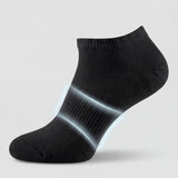 Black ankle sock with arch support on a light gray background