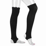 Black over-the-knee compression socks or leg sleeves shown on a transparent mannequin lower leg and foot against a plain white background.