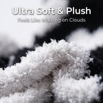 Close-up of a plush, ultra-soft fabric in white and black with overlaid text reading 'Ultra Soft & Plush' and 'Feels Like Walking on Clouds'.